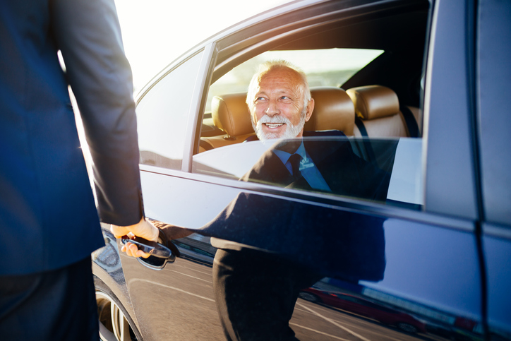 Senior businessman in car