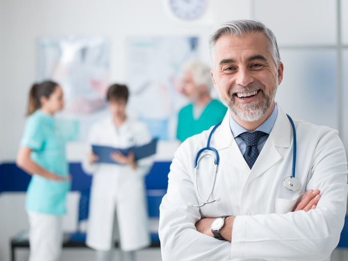 Confident doctor posing at the hospital