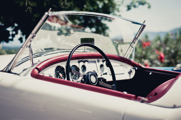 White convertible with red accents on a sunny day