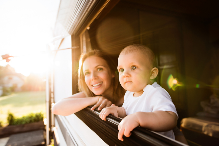 Mother and baby son in a camper van.